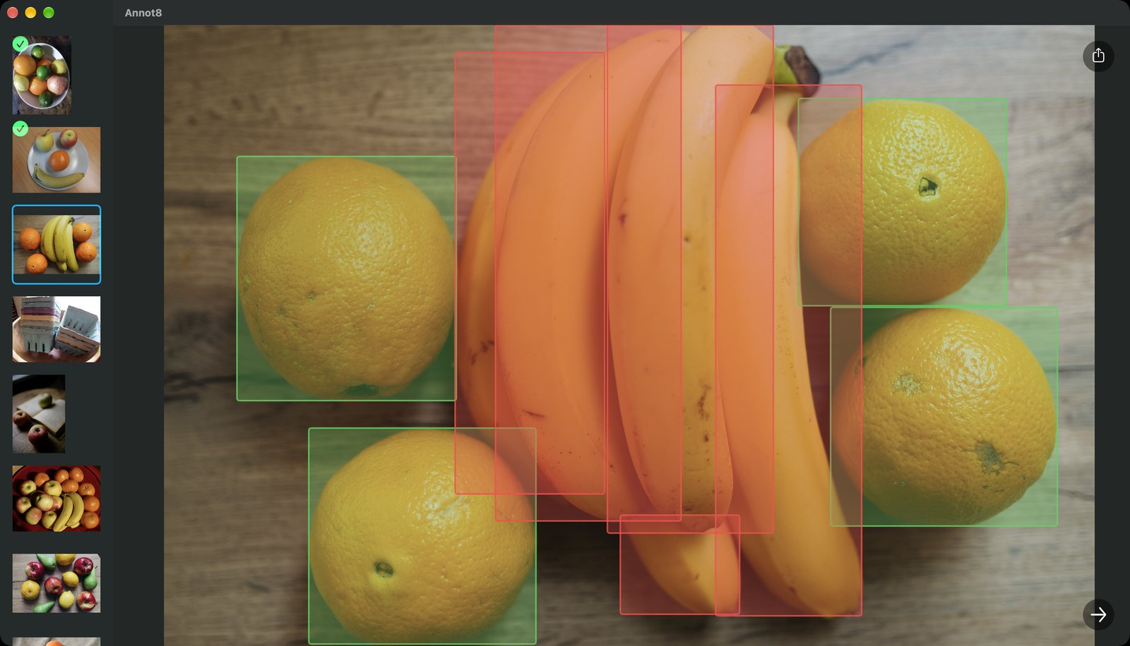 Annot8 on a Mac: a photo of five bananas and four oranges with a green box around each orange and a red box around each banana, a sidebar of fruit photo thumbnails on the left with green ticks on the first two, a share button top right and an arrow button bottom right