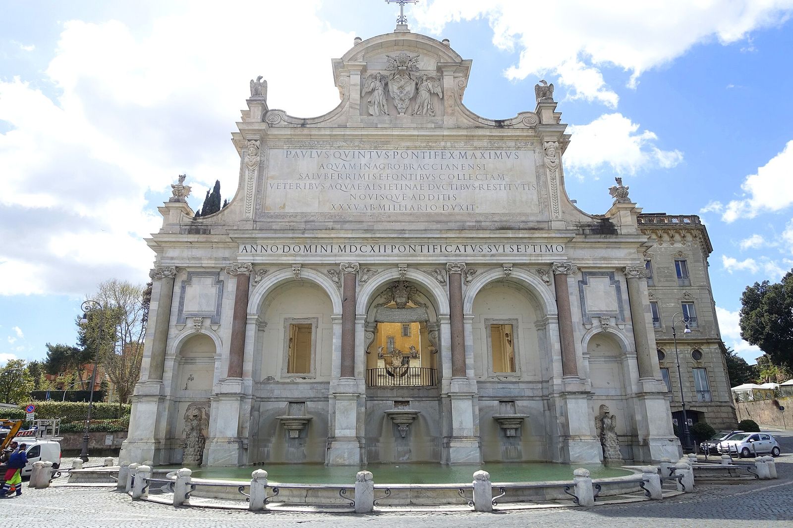 The Fontana dell'Acqua Paola, the Fontanone, on the way up the Gianicolo: a white stone front of arches and columns under a long Latin inscription, above a wide basin