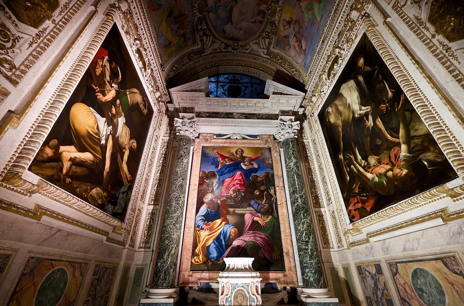 The Cerasi Chapel in Santa Maria del Popolo: Caravaggio's Crucifixion of Saint Peter on the left wall and Conversion of Saint Paul on the right, with Annibale Carracci's Assumption of the Virgin over the altar
